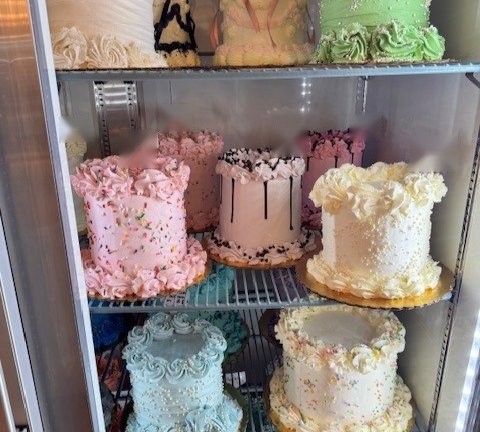 Grab-and-go cakes with pastel buttercream in the Sweet Melissa cake case