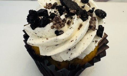 Cookies and cream cupcake with swirled frosting and cookie crumbles