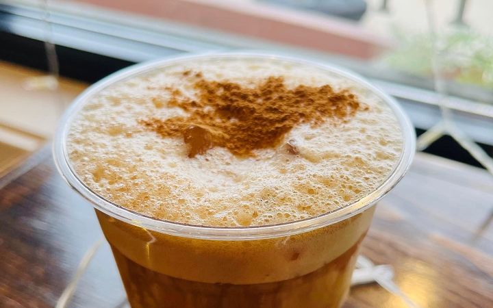 Iced cold brew topped with cinnamon cold foam at Sweet Melissa